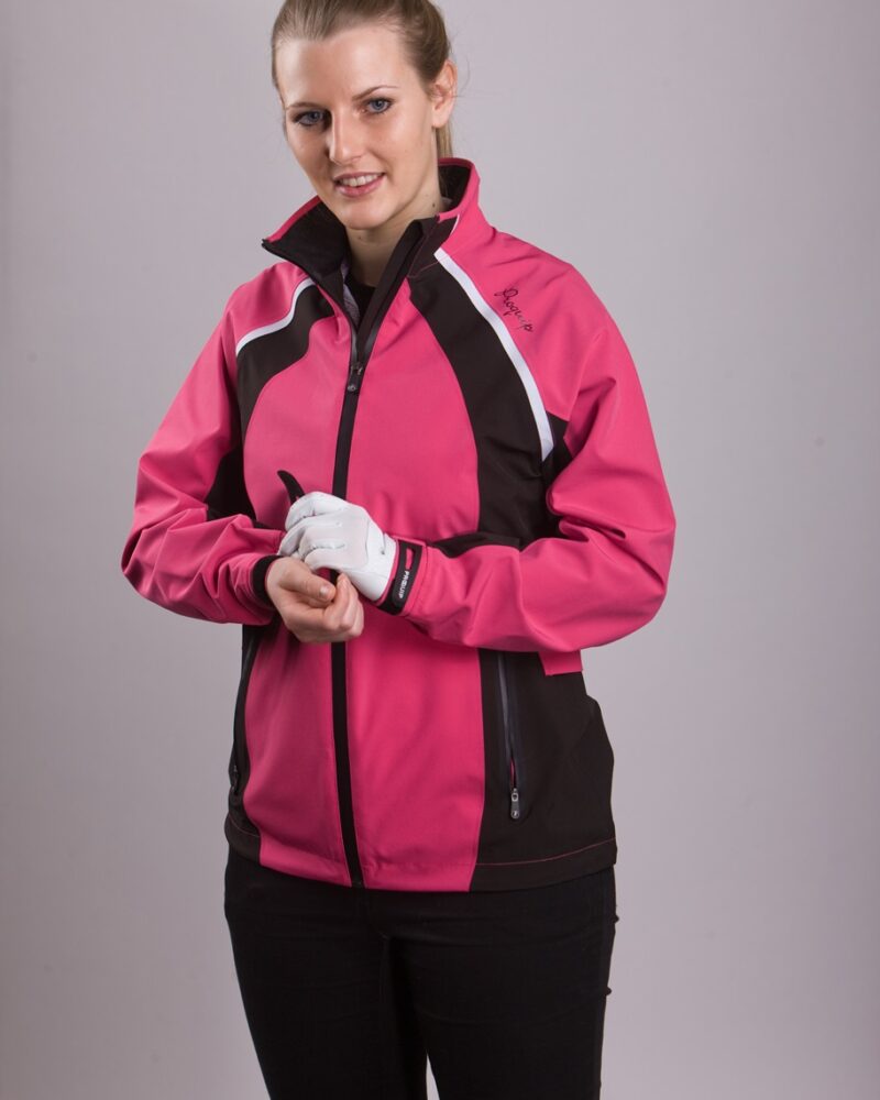 A blonde-haired, blue eyed, lady golfer wearing a ProQuip ProFlex Ladies golf rain jacket