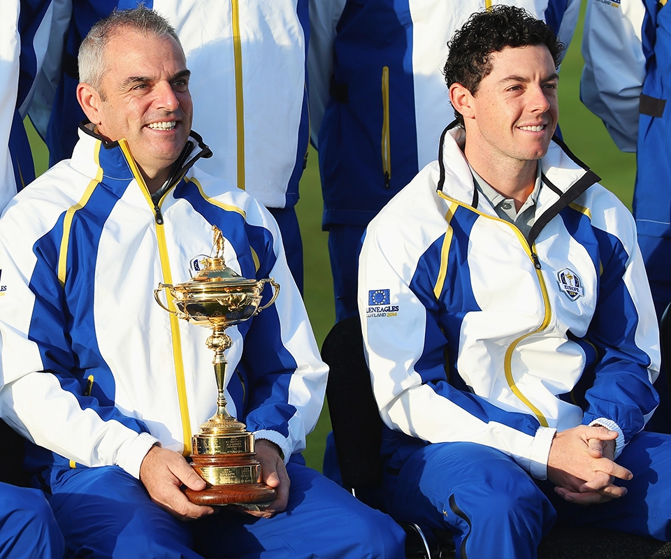 Ryder cup golfers wearing ProQuip and holding the cup